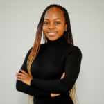 Mary Usaji in Black Dress