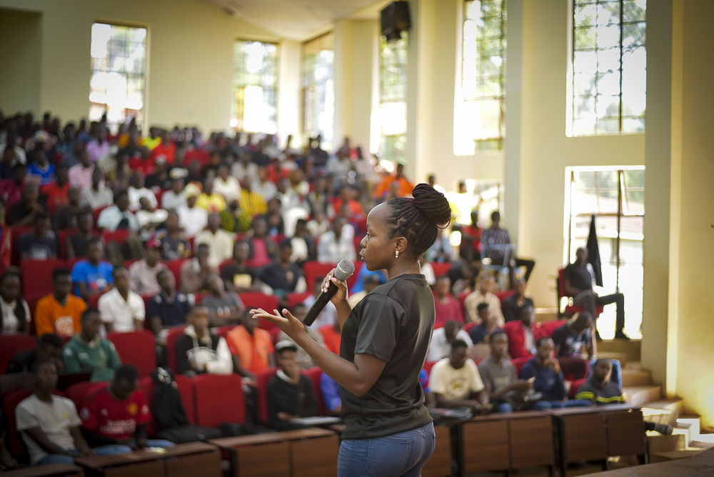 Mary Usaji speaking at University Outreach Event