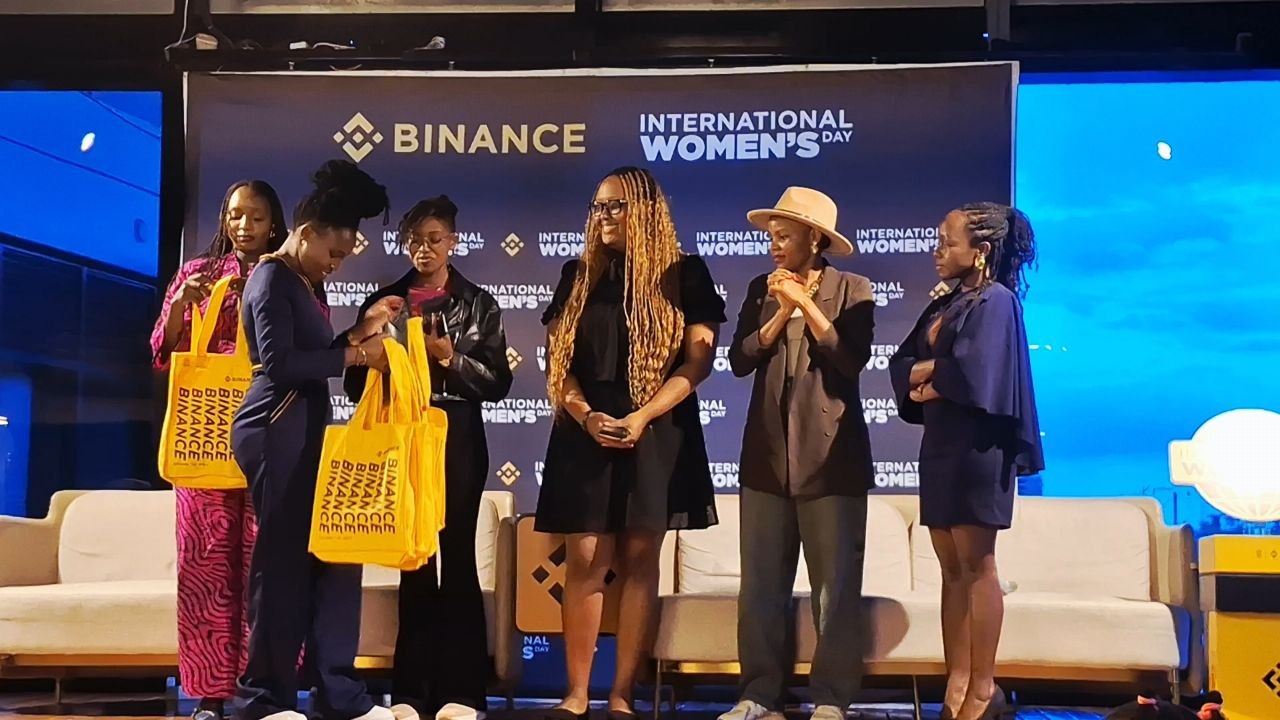 Mary Usaji Getting Awarded at a Panel during the Binance Women's Day Event
