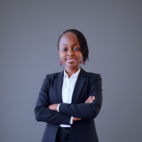 Mary Usaji In a suit